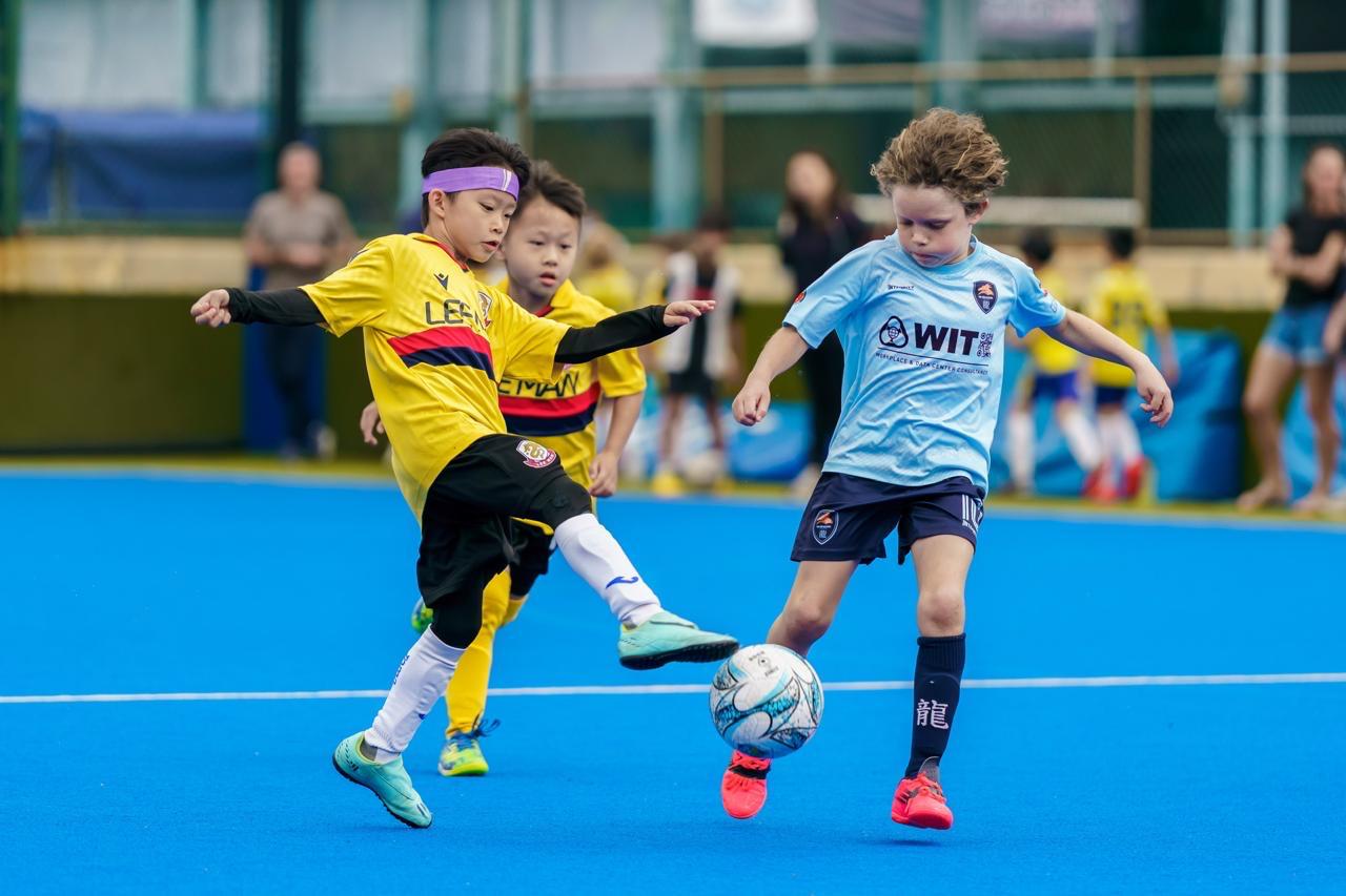 A duel for the ball on an artificial pitch