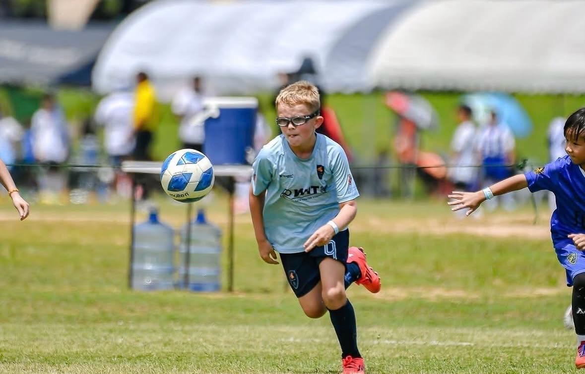 A Dragon bringing the ball under control in a match