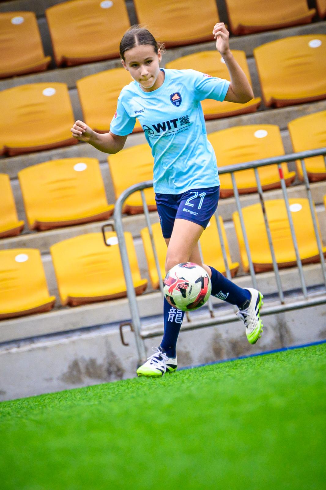 A young Dragon running out during a stadium event