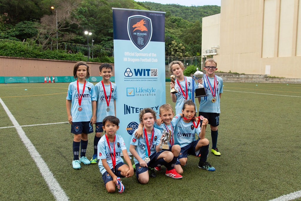 Dragons squad showing off their medals at the 2025 medal ceremony