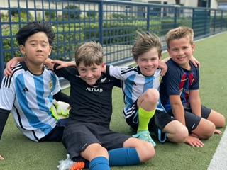 Dragons players posing together during a break in training